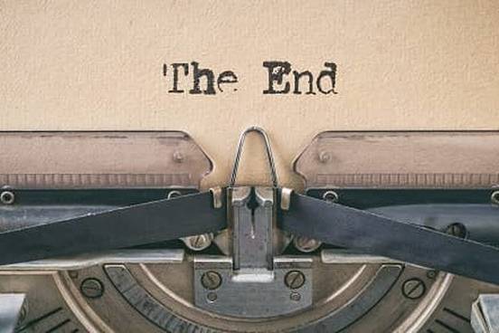 typewriter typing the end